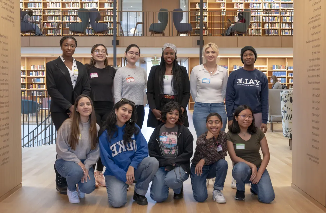 Students participating in Smith's new Money Menntors program pose for a group shot in Neilson Library