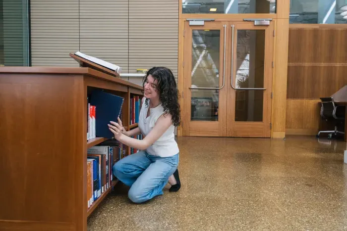 Tallulah Costa '25 interning at the Berkeley Law School Library. She has since earned a fellowship with the Center for the Study of the Presidency and Congress. Photo by Darius Riley